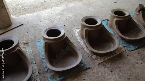 Cooking pots being dried up in the Philippines photo