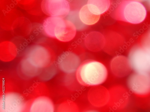 Abstract red pink white bright blurred bokeh defocused circle bubbles lights texture holidays background.Valentine's day decoration wallpaper design.Merry Christmas banner.Love.