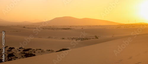 Sand dunes in the National Park of Dunas de Corralejo during a beautiful sunset, Canary Islands - Fuerteventura