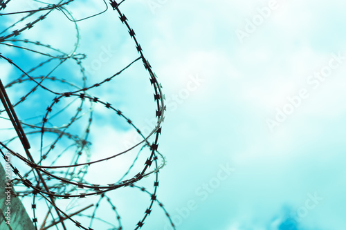 Barbed wire fence attached around prison walls and Border wall for protection corona virus.Wuhan coronavirus and epidemic virus symptoms.Worldwide virus symptoms.Close city.Close countries concept.