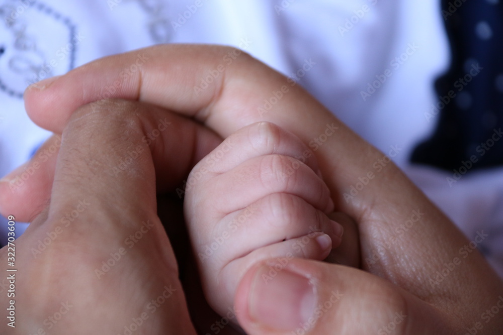 Fototapeta premium hands of mother and baby