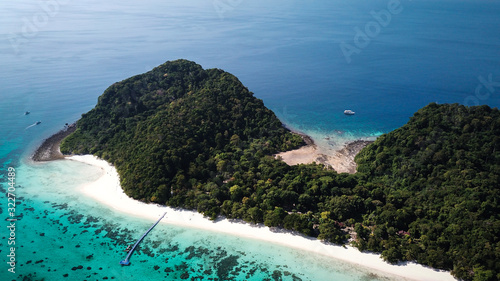 drone view of koh rok in thailand, white beach, coral reef and green jungle with turquoise ocean