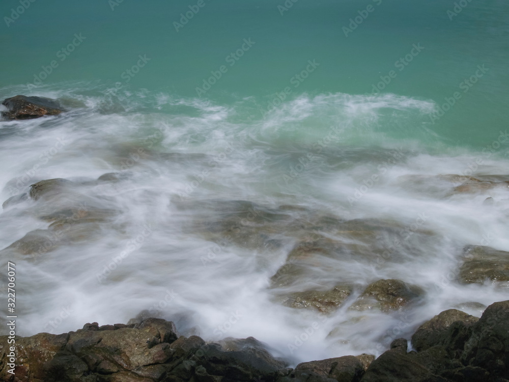 view seaside of silky wave attack many arch rocks with blue-green sea background, Khao Lak-Lam Ru National Park, Phang Nga, southern of Thailand.