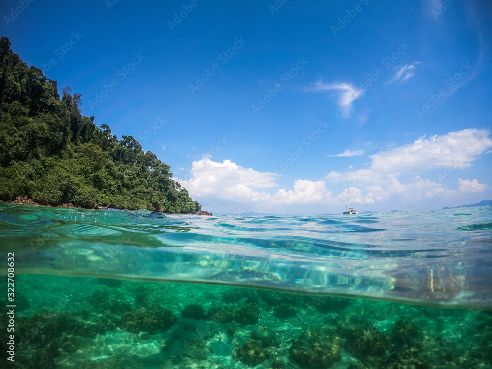 Fototapeta premium Over and Underwater Dome Shot of a private sailing yacht in Thailand
