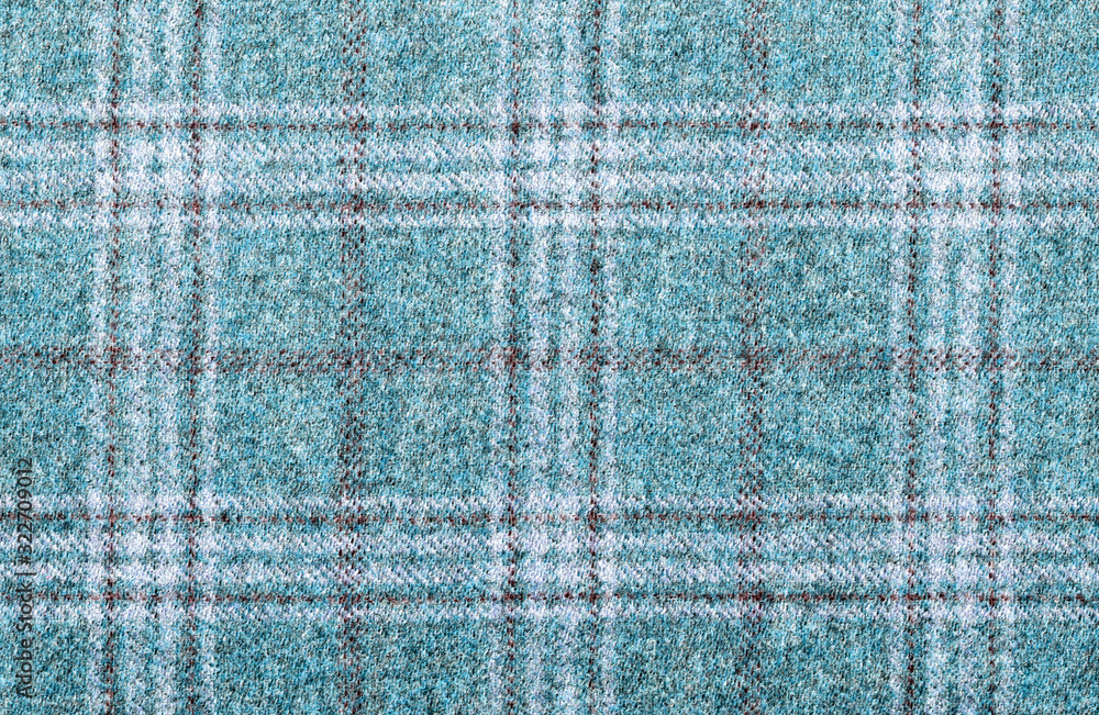Lana vergine, cashmere. Expensive men's suit fabric. Light Turquoise Glenurquhart check is made of woolen fabric with a woven twill design of small and large checks. High resolution Lana vergine, cashmere. Expensive men's suit fabric. Light Turquoise Glenurquhart check is made of woolen fabric with a woven twill design of small and large checks. High resolution
