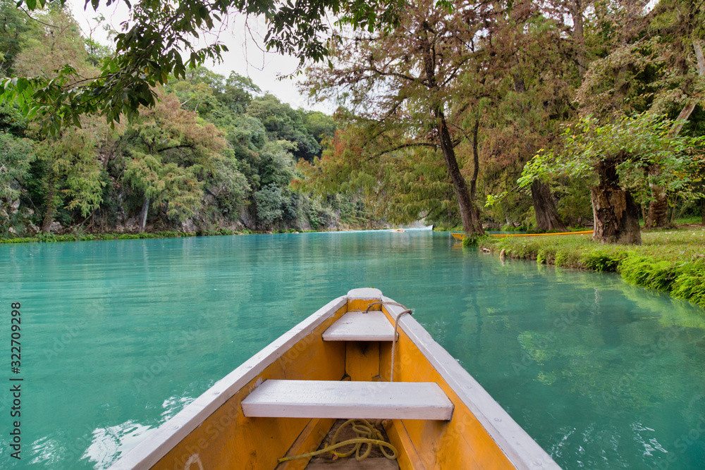 Fototapeta premium (EL SALTO-EL MECO) san luis potosi México, hermosa cascada Turquoise water in a river and cliffs of the reserve. Beautiful natural canyon, blue river water and boating