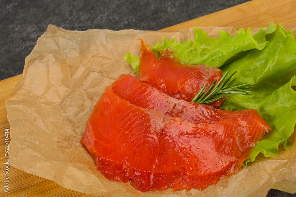 Sliced salmon fillet served rosemary Sliced salmon fillet served rosemary