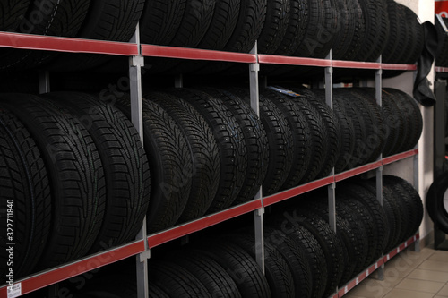 Car tires on rack in auto store