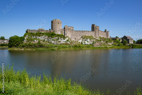 A summer s day view of Pembroke Castle  which is a medieval castle in Pembroke  Pembrokeshire  Wales.