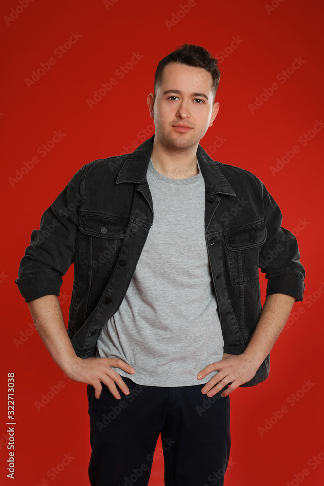 Fototapeta premium Portrait of young man on red background