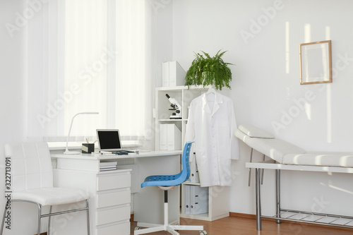 Interior of modern medical office with doctor's workplace