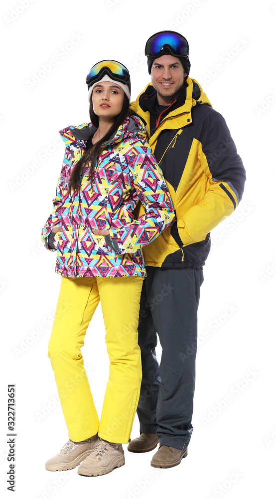 Couple wearing stylish winter sport clothes on white background Couple wearing stylish winter sport clothes on white background