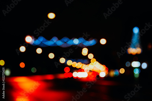 Multicolored bokeh on a dark background, street lights © tenrec