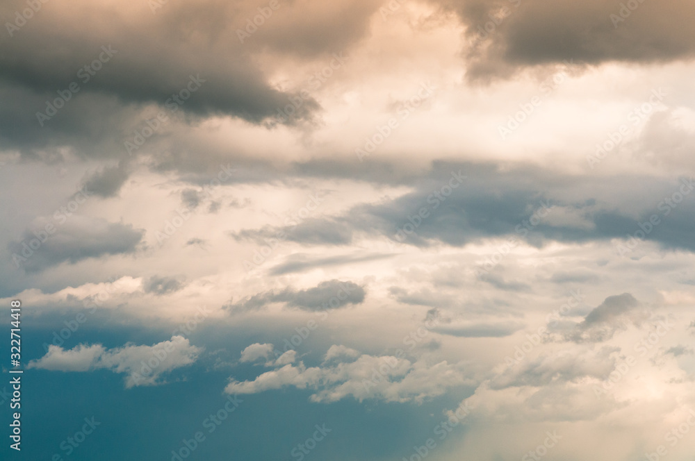 Background of sunset with clouds. Cloudscape under cinematic color filter.