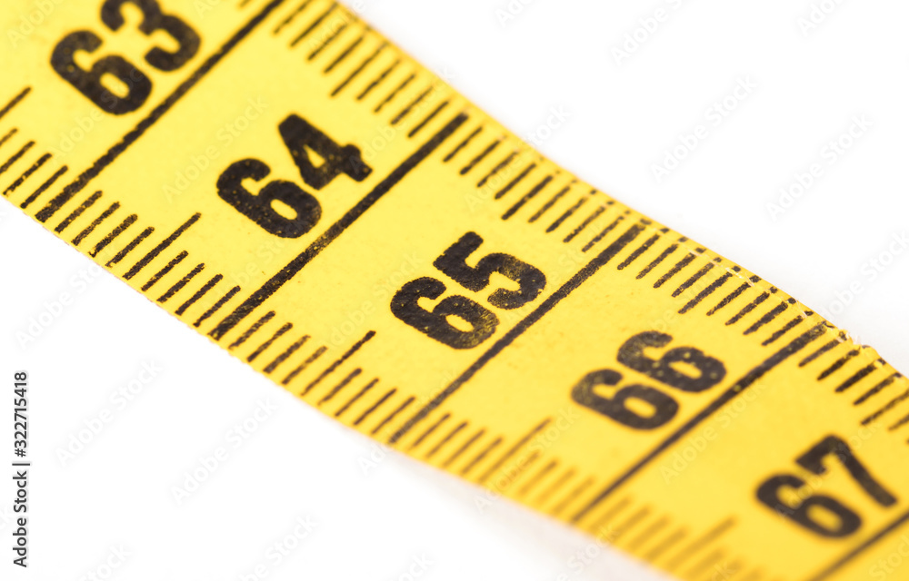 Close-up of a yellow measuring tape isolated on white - 65 Close-up of a yellow measuring tape isolated on white - 65