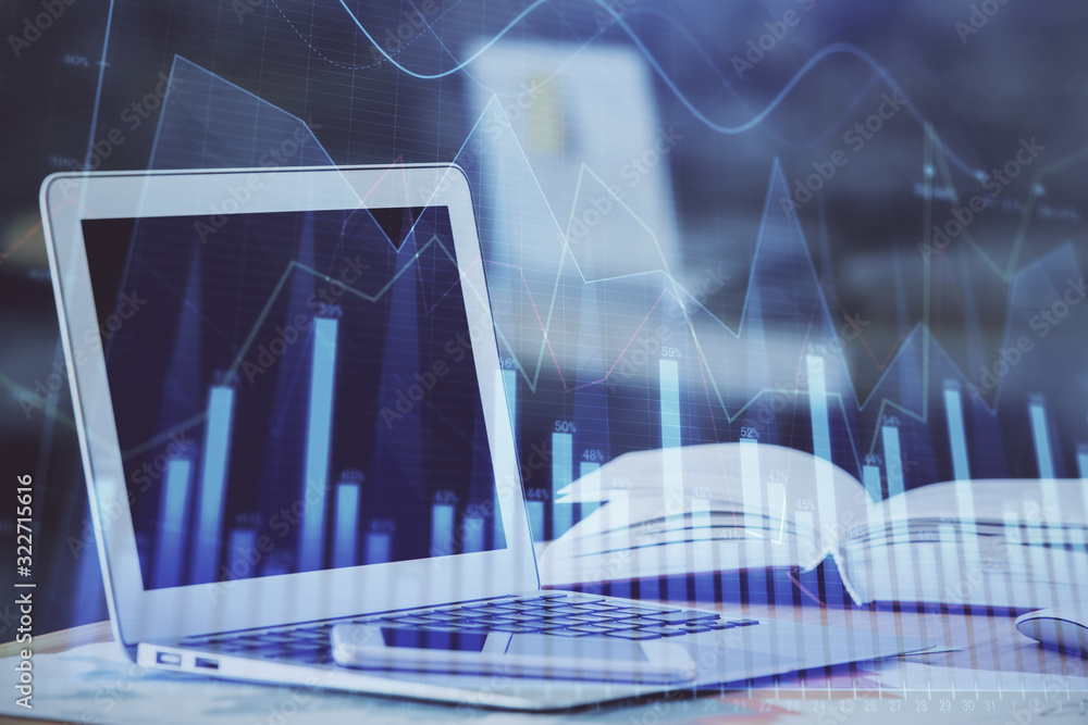 Forex graph hologram on table with computer background. Double exposure. Concept of financial markets. Forex graph hologram on table with computer background. Double exposure. Concept of financial markets.