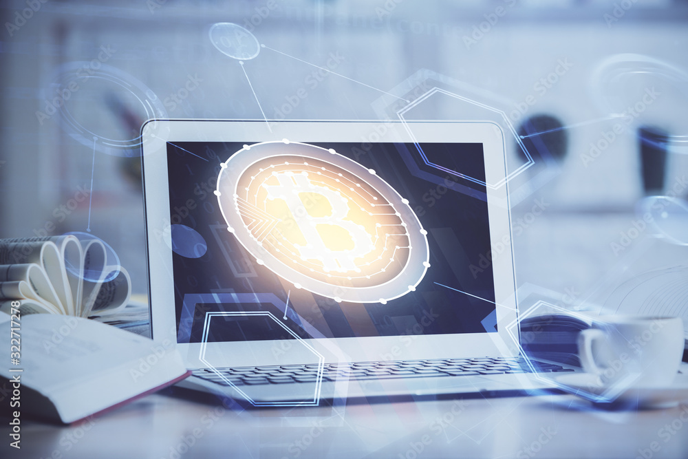 Multi exposure of blockchain and crypto economy theme hologram and table with computer background. Concept of bitcoin cryptocurrency. Multi exposure of blockchain and crypto economy theme hologram and table with computer background. Concept of bitcoin cryptocurrency.