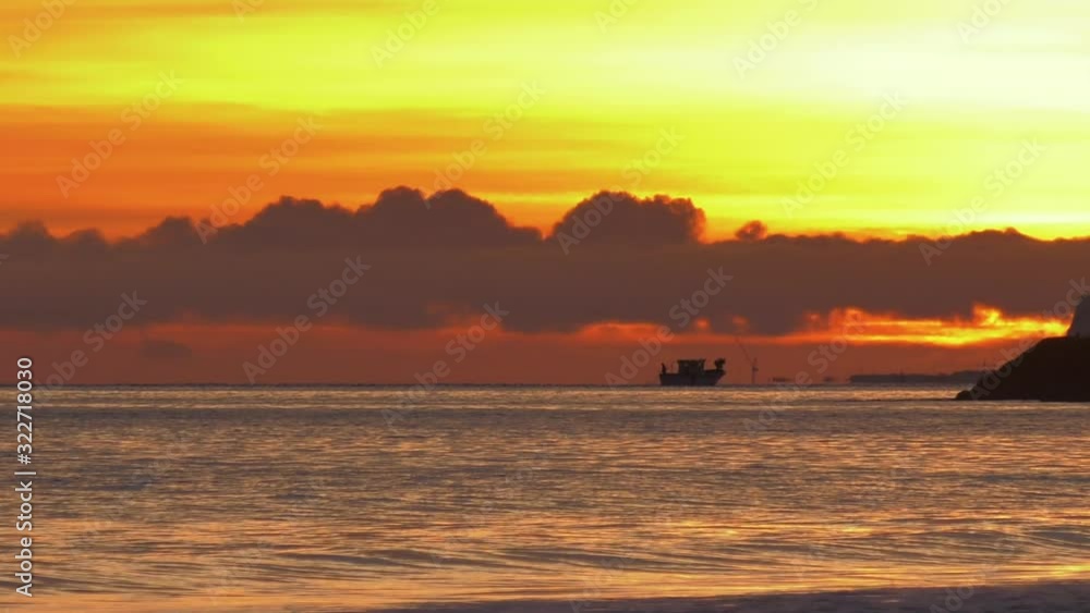 Fishing boat on ocean horizon at dawn Fishing boat on ocean horizon at dawn