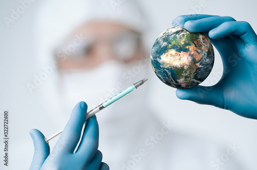 Fotótapéta Pandemic concept, close up of scientist injecitng vaccine into the earth