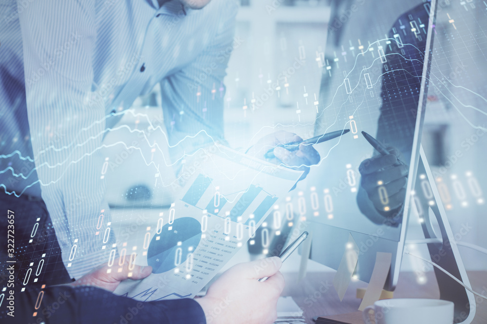 Double exposure of chart with businessman typing on computer in office on background. Concept of hard work. Double exposure of chart with businessman typing on computer in office on background. Concept of hard work.