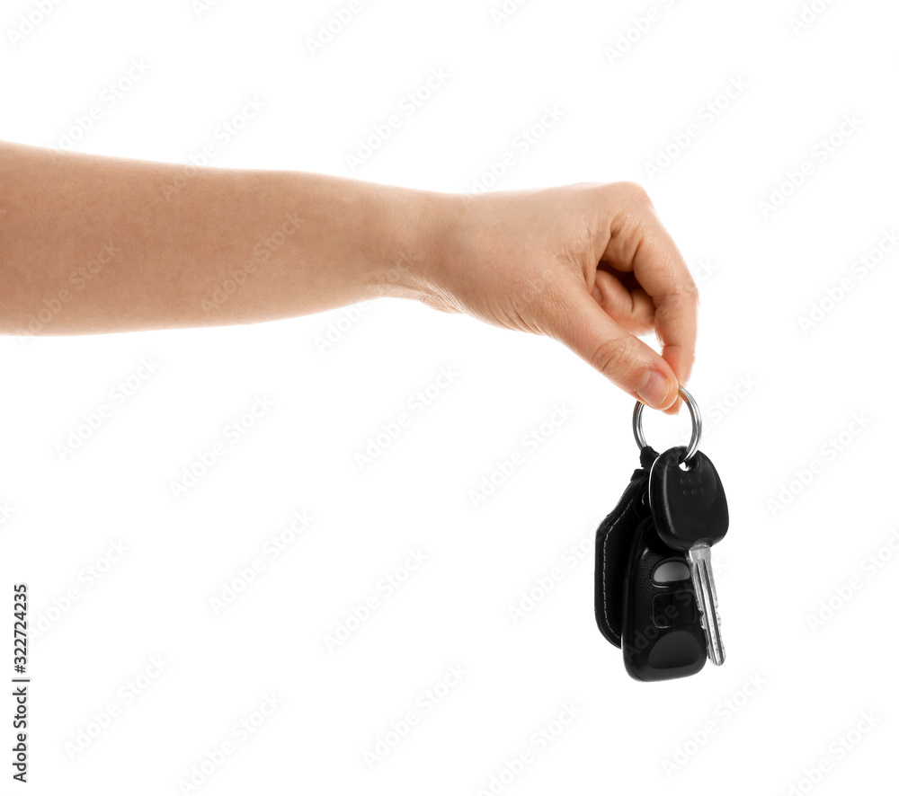 Woman holding key on white background, closeup. Car buying Woman holding key on white background, closeup. Car buying