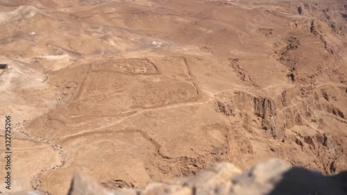 ancient roman camp ruins at the base from masada hilltop israel photo