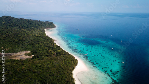 drone shot of koh rok in thailand, beautiful white beach with turquoise coral reef