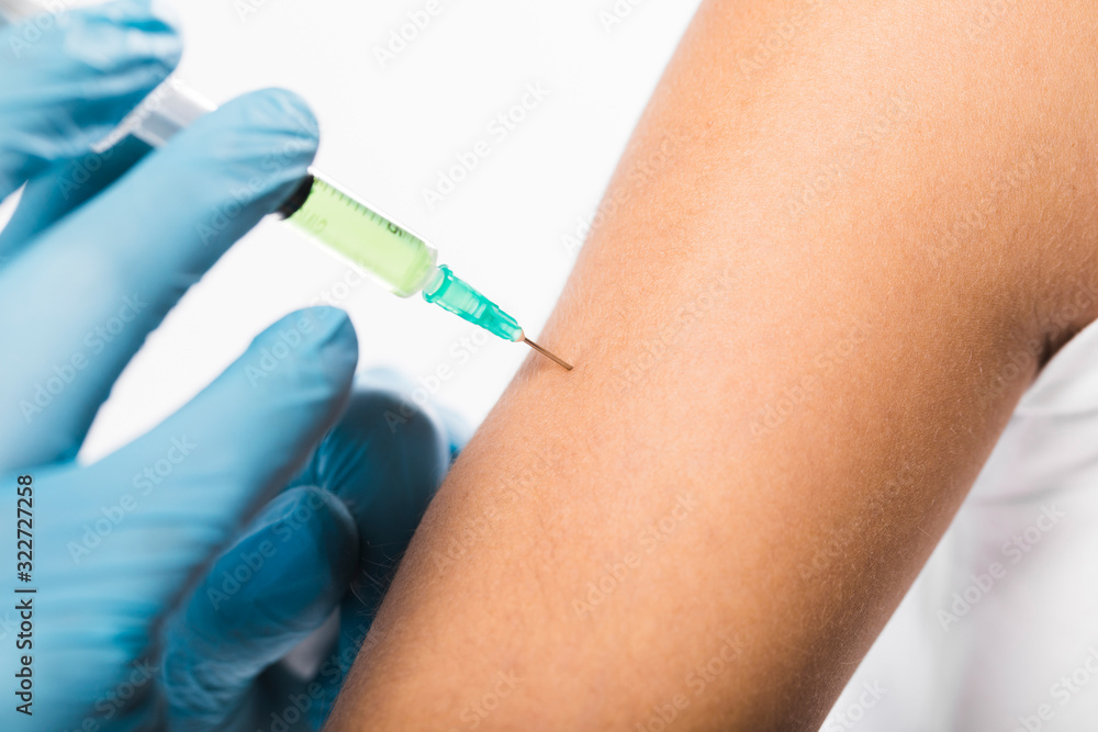 Close-up individual being vaccinated for virus Close-up individual being vaccinated for virus