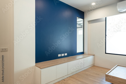 TV shelf with wood floor in bedroom
