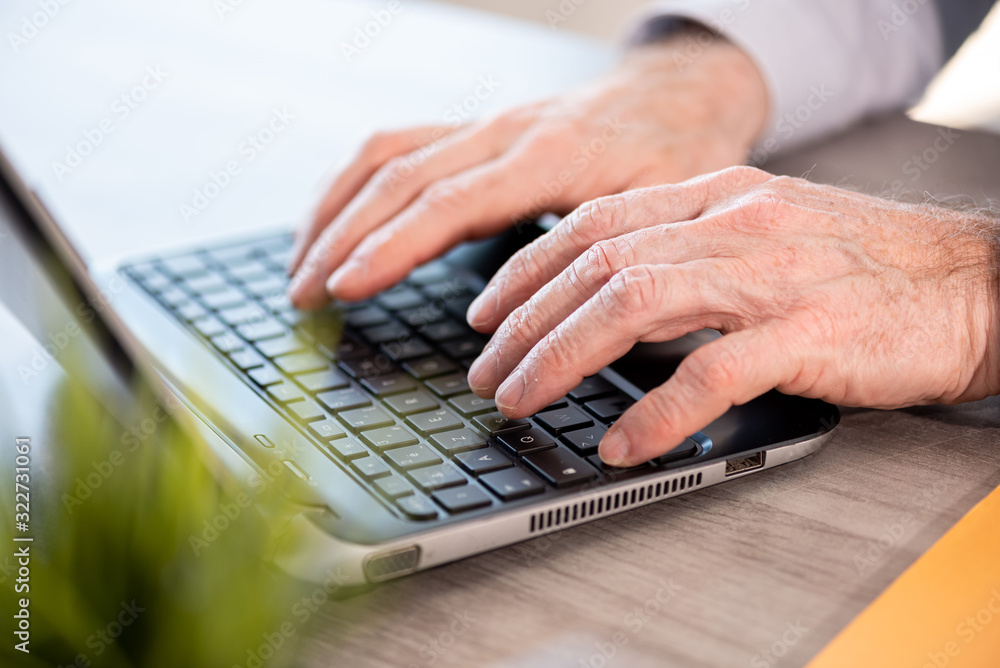 Hands typing on laptop keyboard Hands typing on laptop keyboard