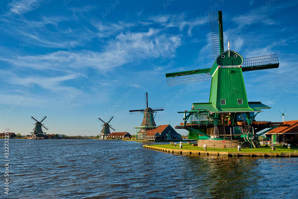 Windmills at Zaanse Schans in Holland on sunset. Zaandam, Netherlands