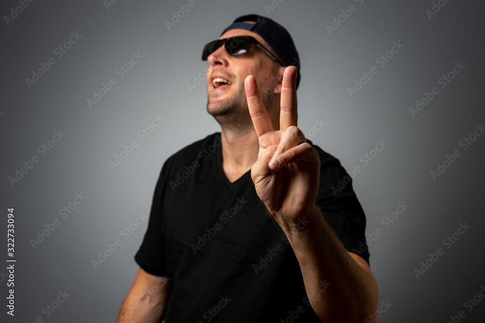 man in black teeshirt and sunglasses man in black teeshirt and sunglasses