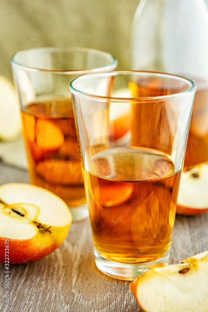 Apple juice in glasses. Apple juice in glasses.