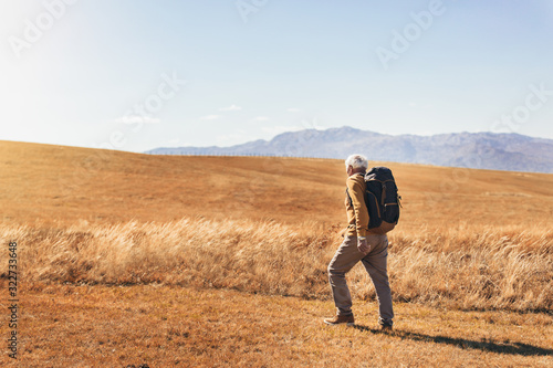 Senior man on hike through beautiful countryside in autumn. © Mediteraneo