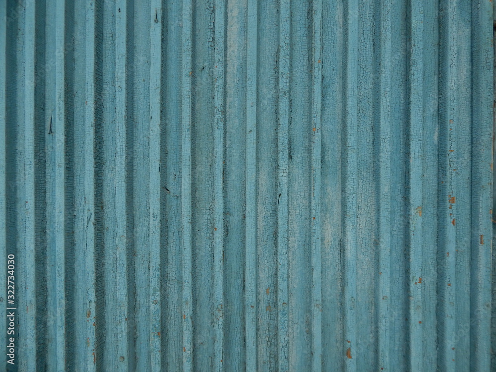 volumetric old wooden background from embossed narrow planks painted in blue volumetric old wooden background from embossed narrow planks painted in blue