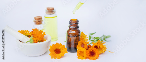 The calendula extract. Medicinal plants. Selective focus. photo