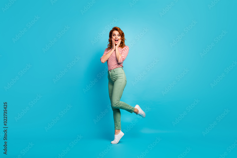 Wow. Full size profile photo of pretty lady enjoy traveling abroad watch amazing view sightseeing wear casual red white shirt green pants footwear isolated blue color background