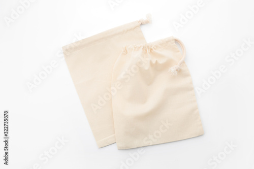 Cotton eco bags isolated on white, top view