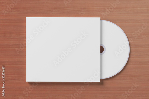 Blank compact disk cover on wooden background