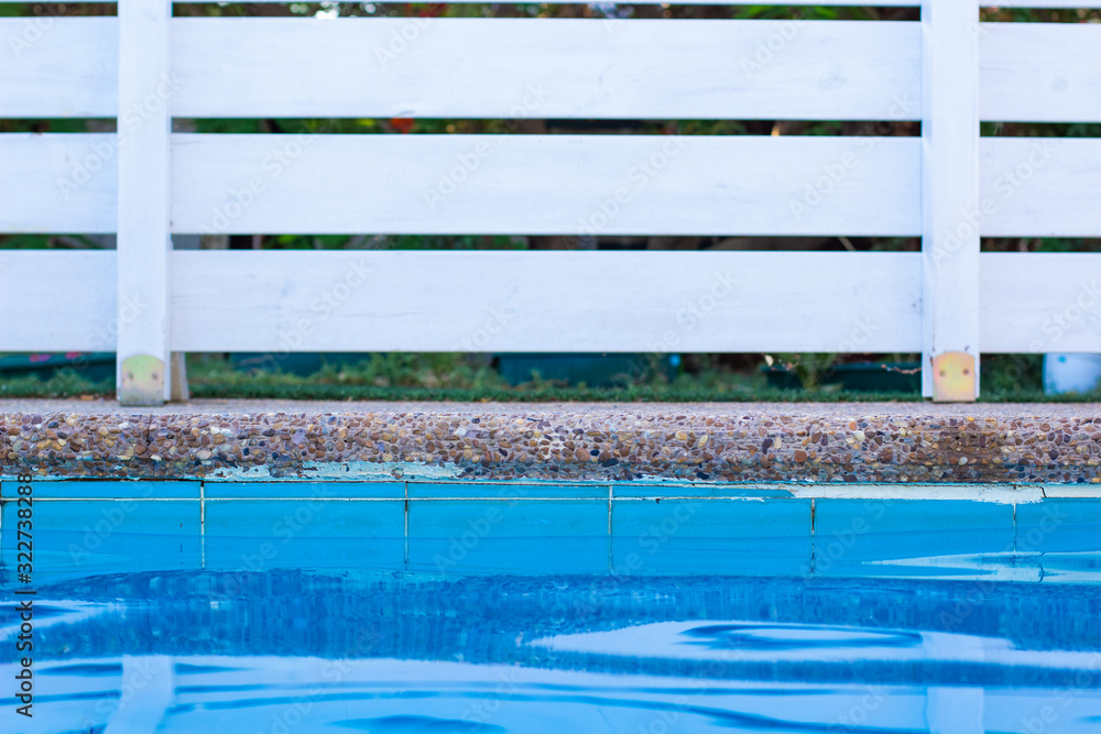 soft focus concept swimming pool side water surface and garden white wooden deck wall background object outside space for copy or your text here