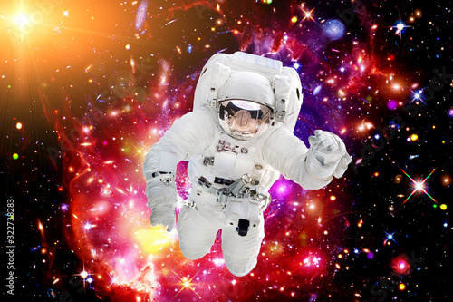 Astronaut against deep space. The elements of this image furnished by NASA. © wowinside