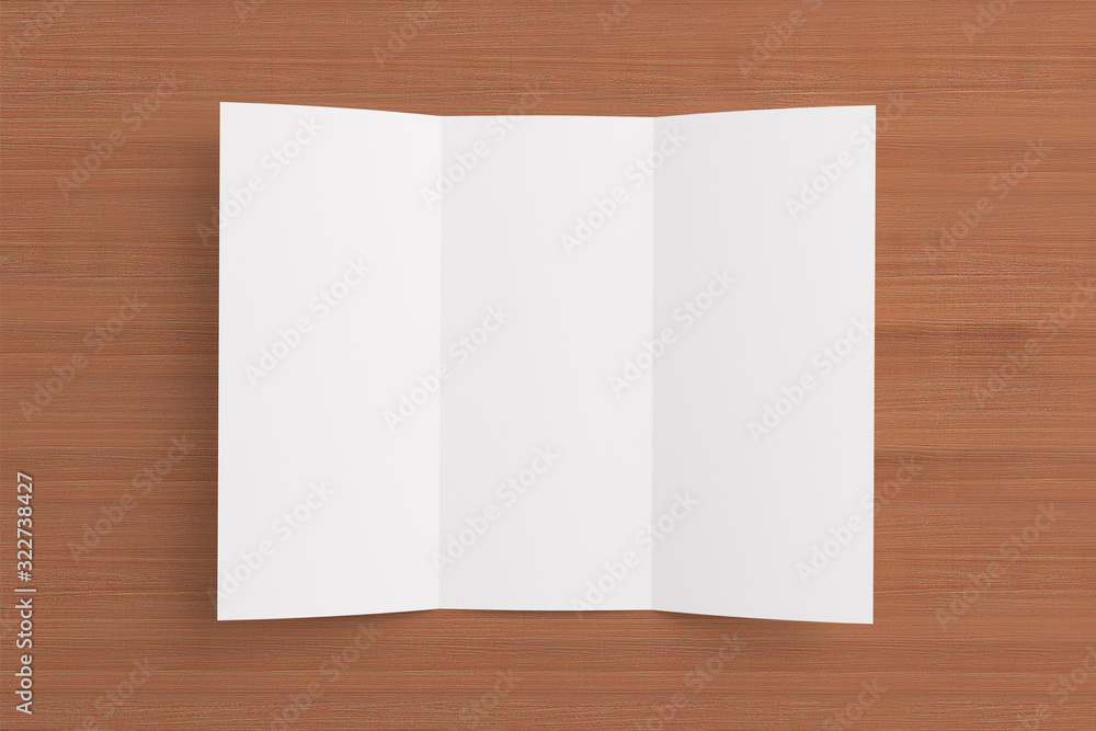 Blank opened tri fold brochure on wooden background Blank opened tri fold brochure on wooden background