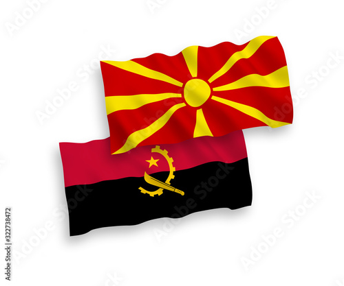 Flags of Angola and North Macedonia on a white background