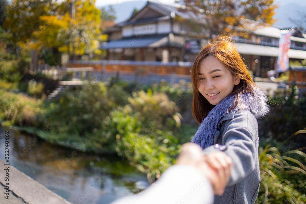 Naklejka premium Lovely Asian girl in style of japanese lady with acting smile on portrait photo.