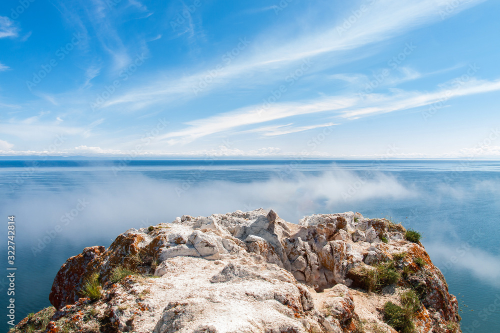 Bright blue sky over cliff on island of Olkhon above Lake Baikal.