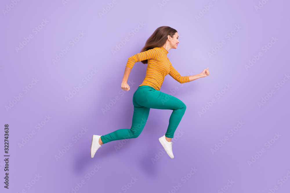 Full length body size view of her she nice attractive lovely charming cheerful cheery glad purposeful energetic girl running fast isolated over violet purple lilac pastel color background