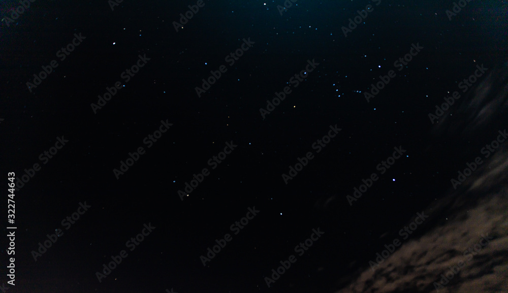 the nightsky showing Orion with some fast moving clouds the nightsky showing Orion with some fast moving clouds