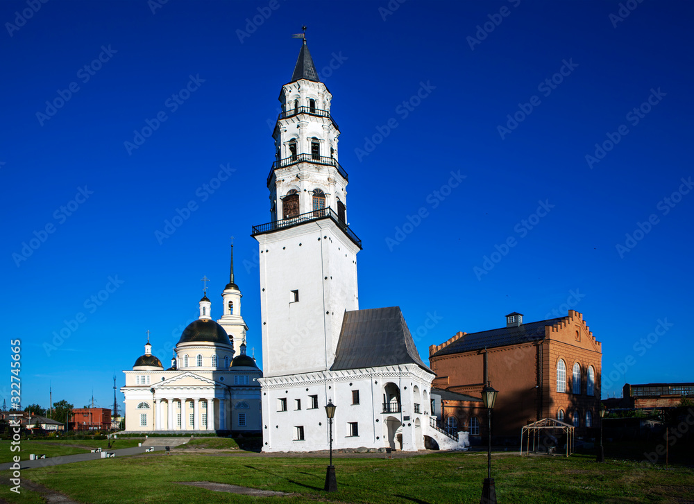 The inclined tower of Demidov, Transfiguration Cathedral and the building of the former power plant. Nevyansk. Sverdlovsk region. Russia