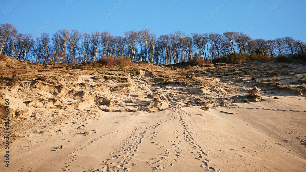 Footprints on a cliff by a Baltic Sea at sunset. Footprints on a cliff by a Baltic Sea at sunset.