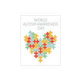 World Autism Awareness day, mental health care concept with puzzle on heart. A colorful heart made of symbolic autism puzzle pieces.